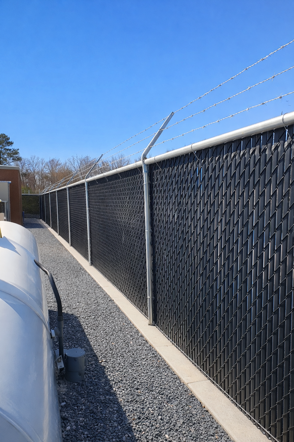 Chain-link fence with privacy slats