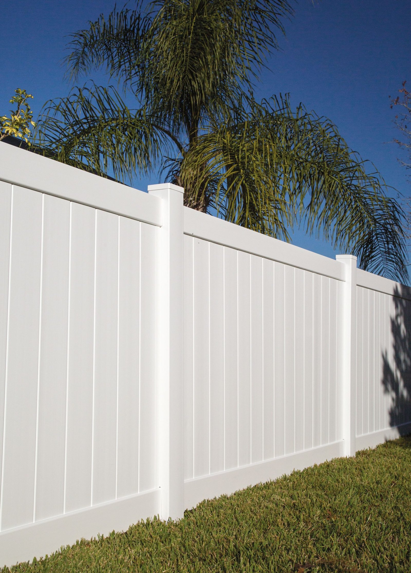 White solid privacy vinyl fence installation — front view